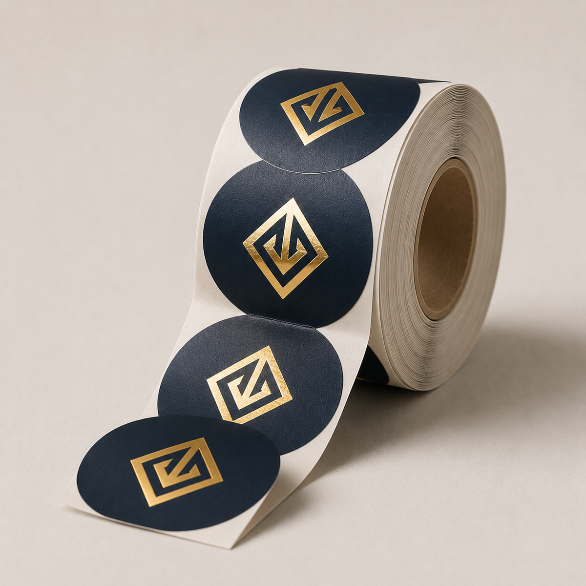 Navy labels with gold foil-stamped logo on textured paper โ foil label printing Dubai