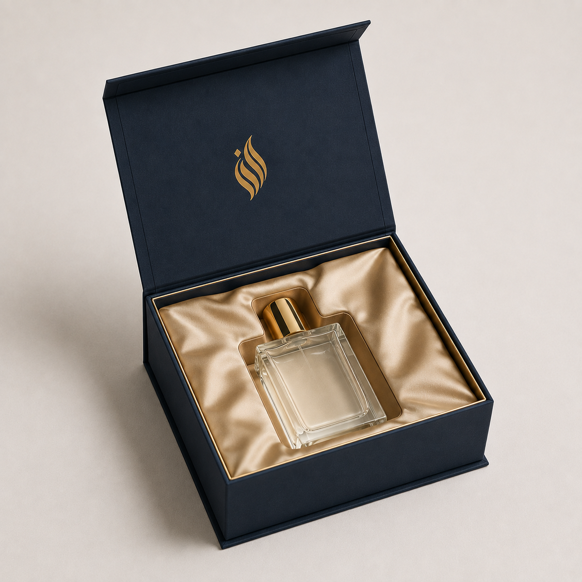 Custom navy magnetic rigid box with fitted satin insert for a perfume bottle — ALEF UAE