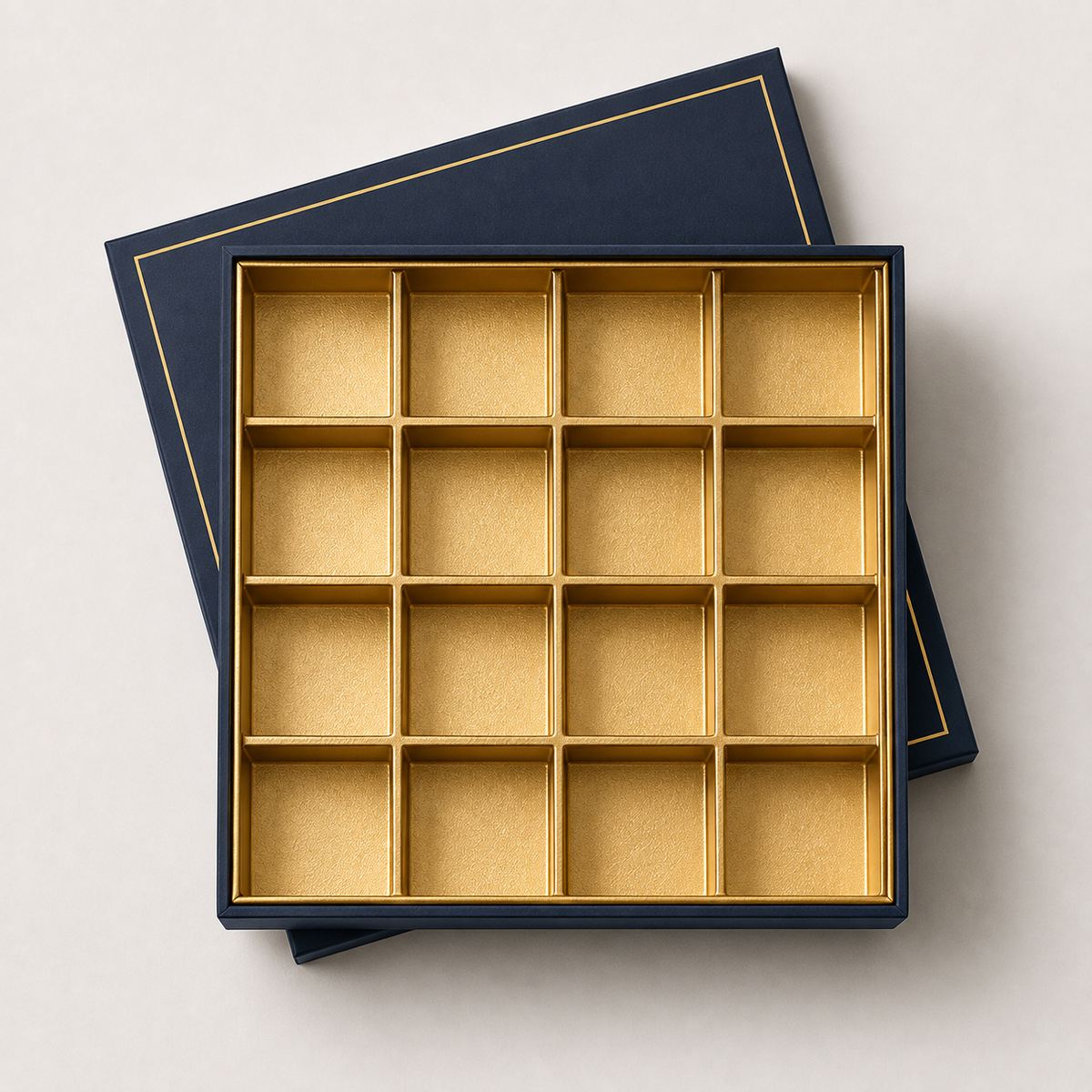 Navy and gold sweets box with grid divider tray — custom mithai packaging UAE