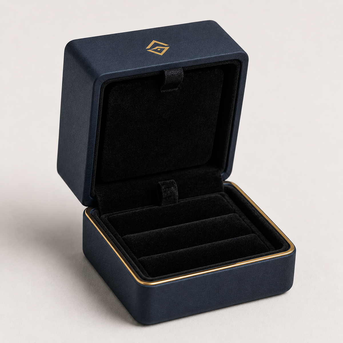 Custom navy velvet ring box with gold logo, open — ALEF UAE