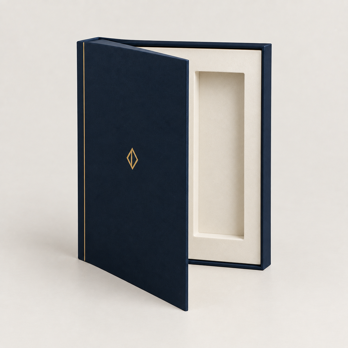 Navy book-style magnetic box open like a hardback with ivory insert — custom book-style rigid boxes Dubai