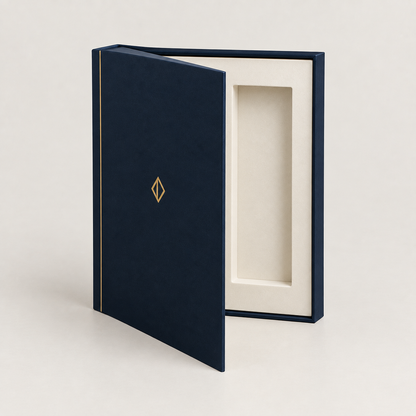Navy book-style magnetic box open like a hardback with ivory insert — custom book-style rigid boxes Dubai