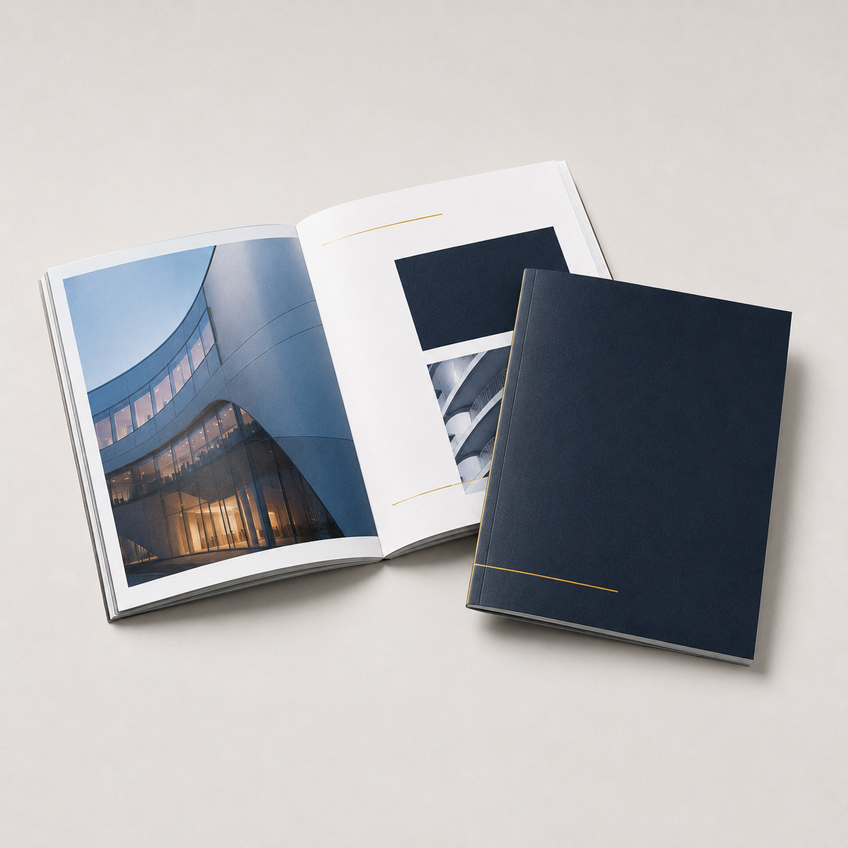 Perfect-bound product catalog with navy cover and gold title, open to a spread — catalog printing Dubai