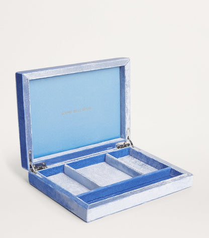 Light blue jewellery organizer box with velvet compartments, open