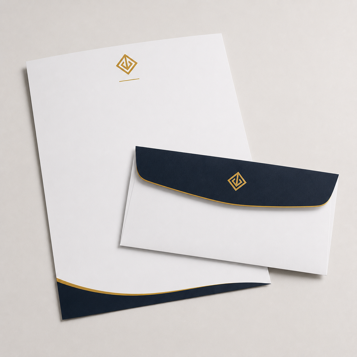 Printed letterhead with navy header and gold logo beside matching envelope — letterhead printing Dubai
