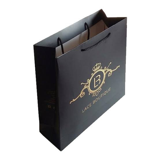 Black luxury paper bag with gold foil crest and rope handles — custom retail bags Dubai