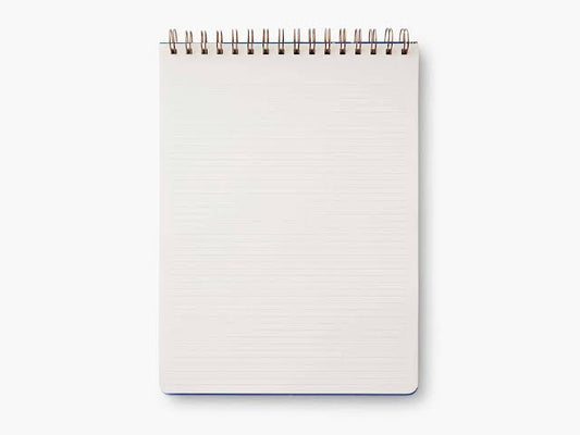 Spiral-bound lined notepad on a desk — custom notepad printing Dubai