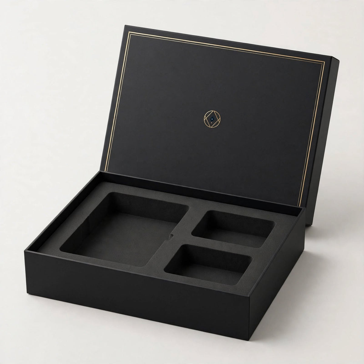 Matte black rigid product box open with die-cut foam insert — custom electronics packaging Dubai