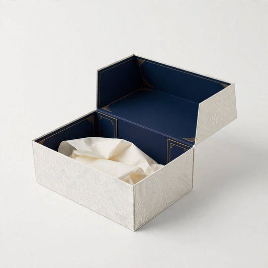 Subscription mailer box open with navy printed interior and folded tissue paper — custom subscription box packaging Dubai